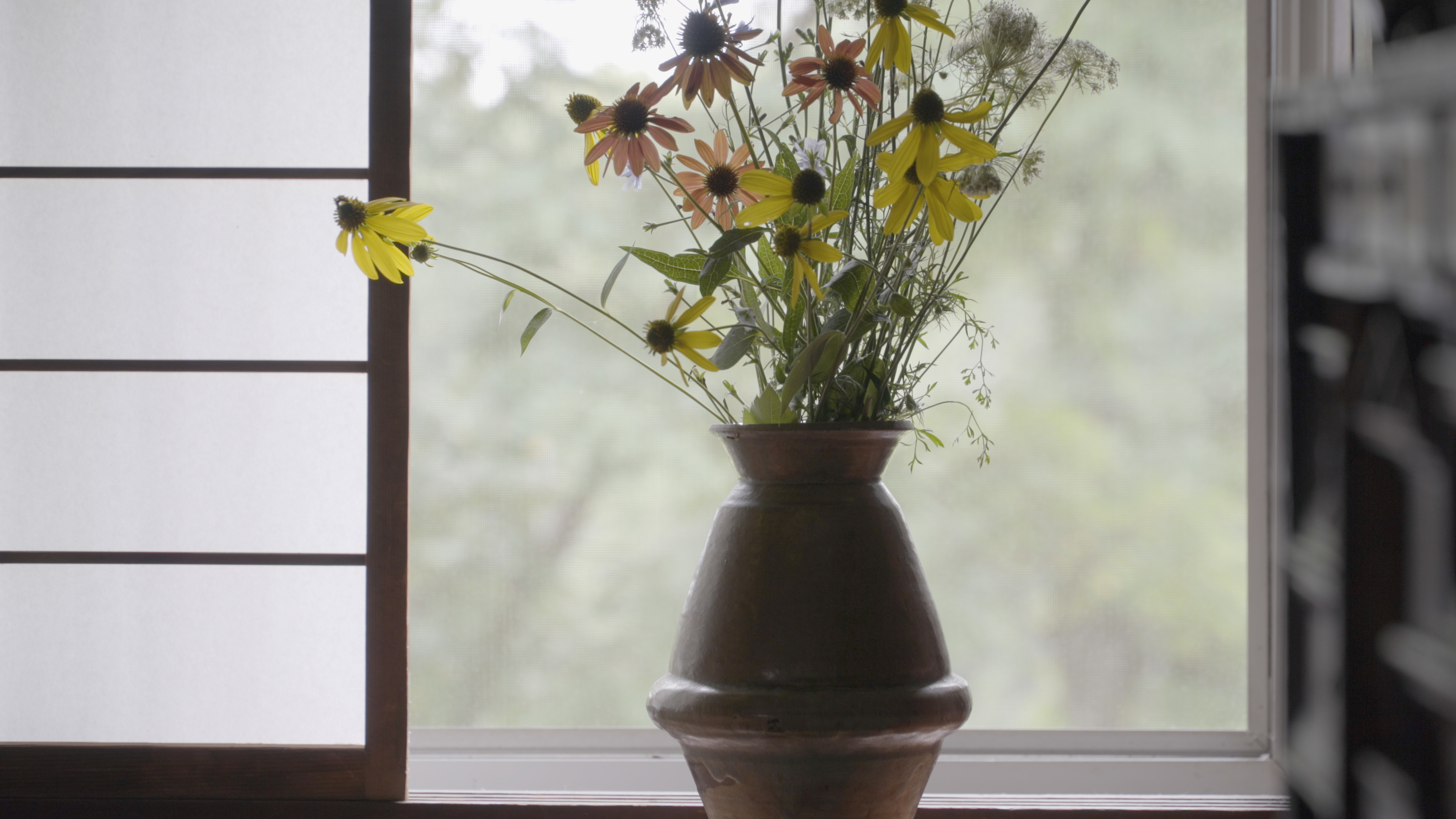 Freshly picked flowers and shoji inside the study at Raymond Farm in New Hope, PA